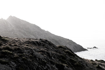 View of a rocky coastline landscape during sunset