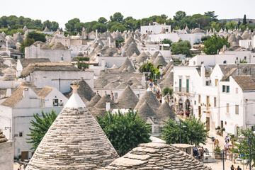 Panoramic view of beautiful Trulli, traditional Apulian dry stone hut old houses with a conical...