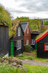Obraz premium Tinganes, the old town of Tórshavn still made up of wooden houses with turf roofs. Tórshavn (Thor's harbour) is the capital and largest city of the Faroe Islands