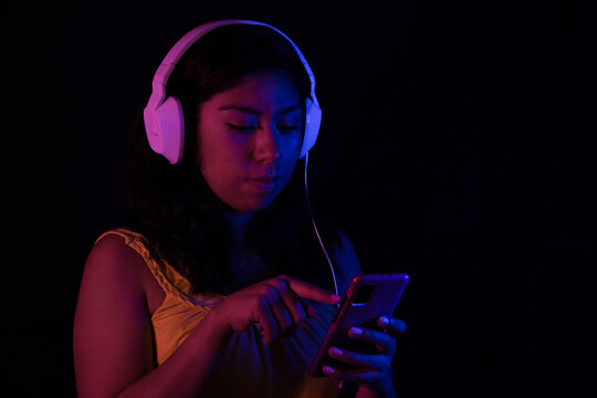 Girl listening to relaxing music with headphones