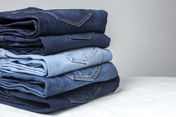 Blue jeans pants clothes pile background - obrazy, fototapety, plakaty