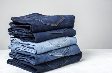 Blue jeans pants clothes pile background