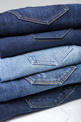 Blue jeans pants clothes pile background