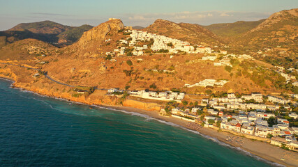Obraz premium Aerial drone photo of breathtaking and picturesque main village of Skyros island featuring uphill medieval castle with scenic views to Aegean sea at sunset, Sporades islands, Greece