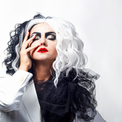 charismatic unusual woman in a black and white outfit with black and white hair,