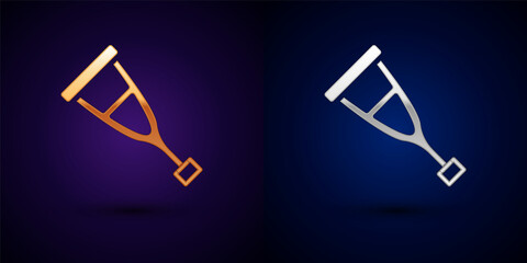 Gold and silver Crutch or crutches icon isolated on black background. Equipment for rehabilitation of people with diseases of musculoskeletal system. Vector