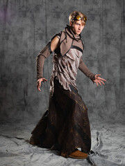 Fototapeta premium Steampunk or post-apocalyptic style character, a young man in a grunge suit.