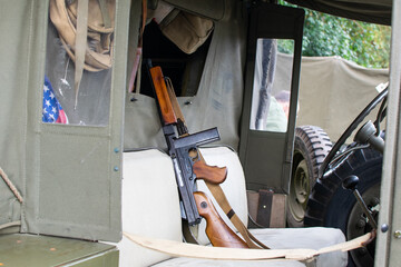 Sheringham, Norfolk, UK - SEPTEMBER 14 2019: M1 Thompson semi-automatic gun on the seat of a WWII jeep
