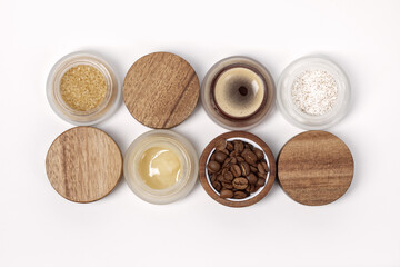 Brown sugar, coffee and honey ingredients for scrub in glass jars with wooden lid for homemade cosmetic. Beauty, Spa, skin care, aromatherapy, moisturising, peeling, exfoliation