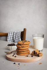 Healthy breakfast concept with a glass of milk and freshly baked homemade cookies with chocolate...