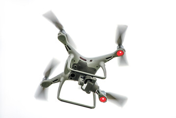  A copter drone flying on a white the background.