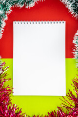 Blank white notepad on a Christmas background.