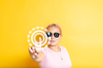 young woman wearing smart glasses touching futuristic hologram