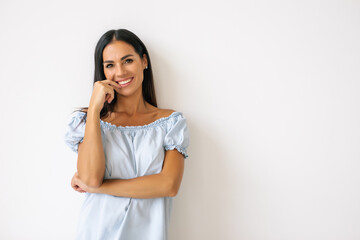 Beauty portrait of a smiling woman looking at camera on a white background