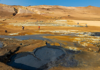 surreal landscape in   geothermal area near Lake Myvatn, Iceland.  Hverir is characterized by boiling mud pots and fumaroles that steam. 