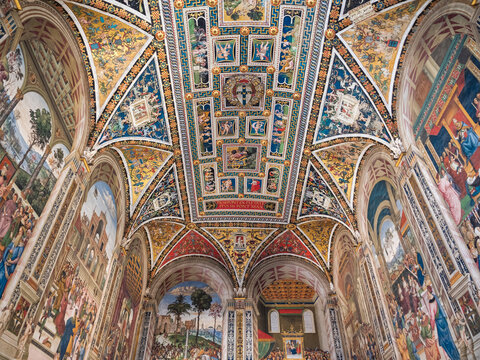 Siena, Italy - August 15 2021: Piccolomini Library Vault Ceiling Interior, a Renaissance Art Concept, located in Siena Cathedral with Frescoes by Pinturicchio