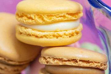 yellow macaron close up on another macaron