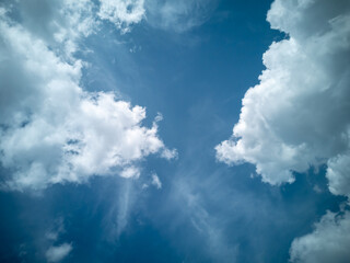 Beautiful blue sky with large white clouds. Postcard layout with place for text, wallpaper.