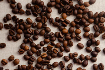 aromatic coffee grains close-up on a light background