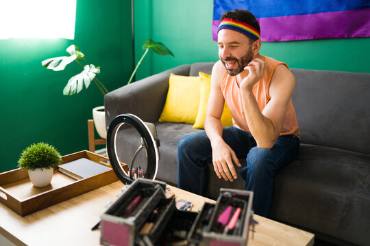 Hispanic gay man filming a video