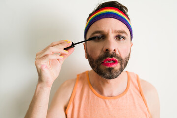 Non binary person using makeup products