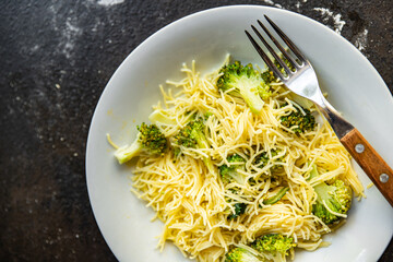 broccoli pasta fine vermicelli second course no meat fresh meal snack on the table copy space food background rustic. top view keto or paleo diet veggie vegan or vegetarian food