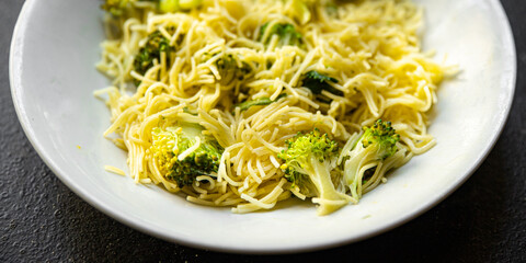 broccoli pasta fine vermicelli second course no meat fresh meal snack on the table copy space food background rustic. top view keto or paleo diet veggie vegan or vegetarian food