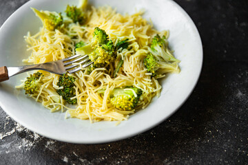 broccoli pasta fine vermicelli second course no meat fresh meal snack on the table copy space food background rustic. top view keto or paleo diet veggie vegan or vegetarian food