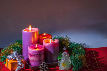 Beautiful view of Christmas burning candles and decoration objects isolation on black background. Sweden.