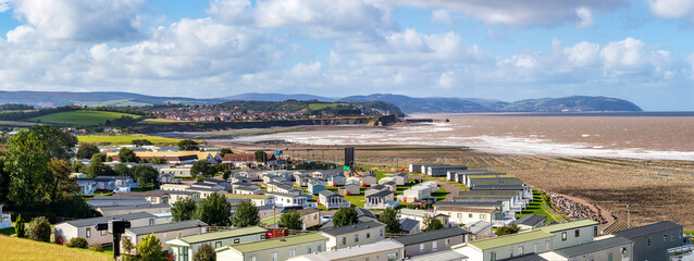Doniford Bay, Somerset, United Kingdom October 1, 2021:A panoramic view of Don ford Bay, Somerset looking west towards Minehead, capturing the hills of Exmoor and the Bristol Channel