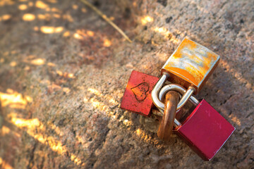 Three love locks with an engraved heart