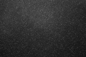 Mottled grainy black and white artificial stone surface