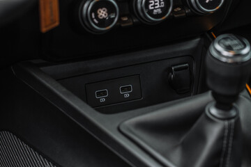USB port in the car panel close up. Car interior detail. Car usb charger detail.