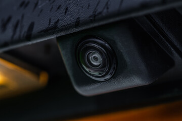 Close up view of rear view parking assist video camera on the car. Modern rear view cameara on...