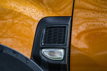 Modern SUV turn signal. Car turn signal close up. Close up of the left turn signal.