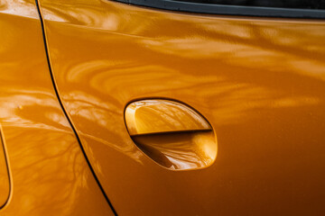 Doorknob of modern car close up view. Handle on the passenger car door without sensor.
