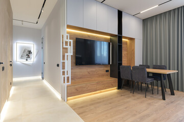 Modern luxury stylish apartment interior in pastel colors. a very bright room with huge windows filled with daylight. blue walls, wooden parquet floors