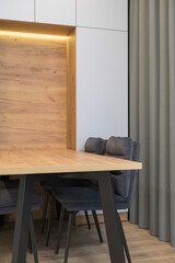 Modern luxury stylish apartment interior in pastel colors. a very bright room with huge windows filled with daylight. blue walls, wooden parquet floors