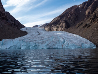 photos of mountains, glaciers, icebergs, and sea ice in the Canadian Arctic landscape. 
