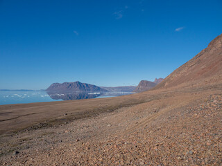 photos of mountains, glaciers, icebergs, and sea ice in the Canadian Arctic landscape. 