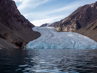 photos of mountains, glaciers, icebergs, and sea ice in the Canadian Arctic landscape. 