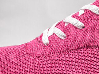 close up of pink shoe with laces