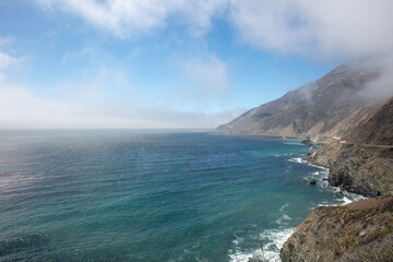 A Beautiful Sea Cliff on the Pacific California Coast on Highway 1, Pacific Coast Highway with a Low Fig Layer on the Rugged Coast