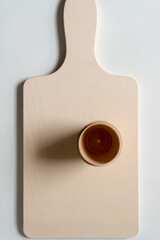 wood cup isolated on a wooden board