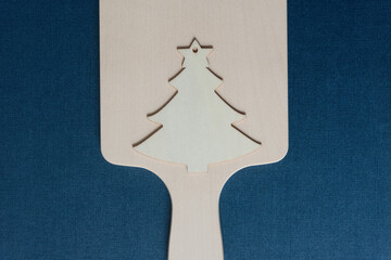 wooden christmas tree shape silhouette on a wooden board