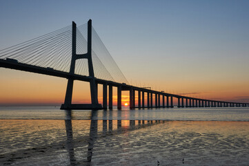 Long exposure shot of Vasco da Gama bridge in Lisbon at sunrise
