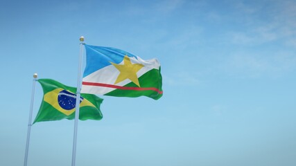 Waving flags of Brazil and the Brazilian state of Roraima against blue sky backdrop. 3d rendering