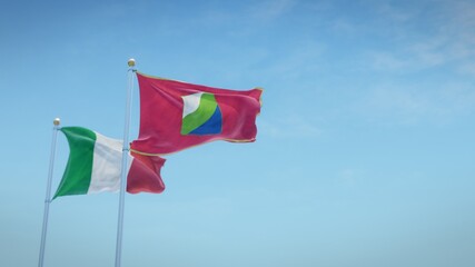Waving flags of Italy and the Italian region of Abruzzo against blue sky backdrop. 3d rendering