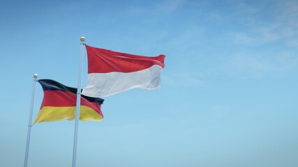 Waving flags of Germany and the German state of Hesse against blue sky backdrop. 3d rendering