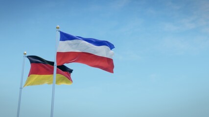 Waving flags of Germany and the German state of Schleswig-Holstein against blue sky backdrop. 3d rendering